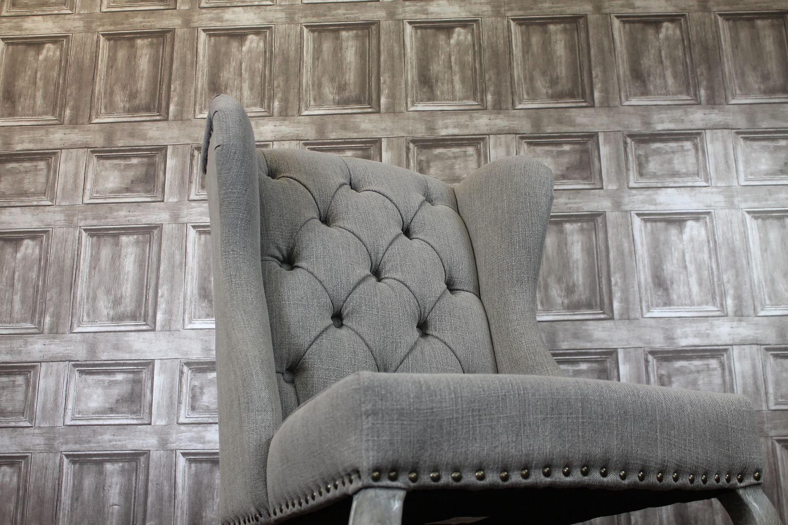 WINGED UPHOLSTERED FRENCH STYLE DINING CHAIRS WITH BUTTON BACK IN STONE