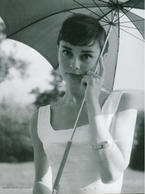 Audrey hepburn under an umbrella
